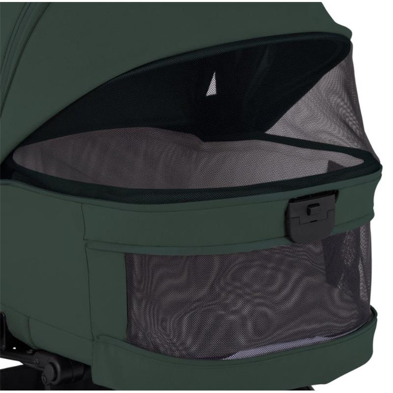Silver Cross Nia compact travel stroller bassinet bundle in conifer color, featuring mesh ventilation and a secure closure.