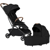 Silver Cross Nia Compact Travel Stroller in Onyx with brown handle, paired with a matching bassinet.