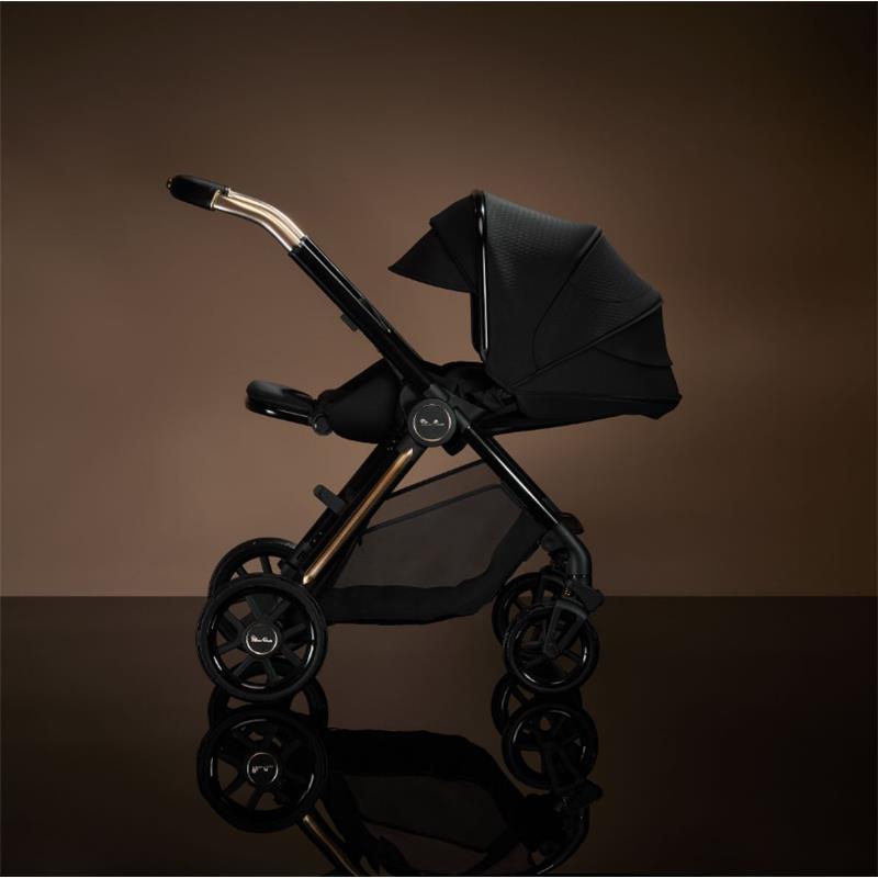 Silver Cross - Reef 2 Multi-Terrain Modular Stroller in Espresso with stylish black fabric and gold accents, shown from the side.