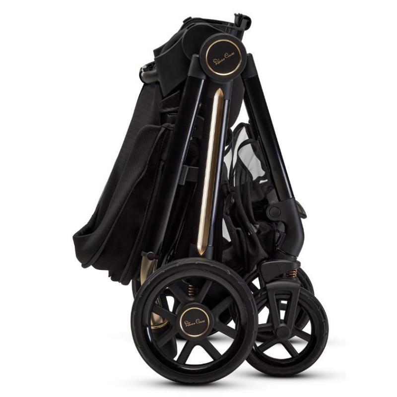 Silver Cross Reef 2 modular stroller in Espresso Special Edition, folded with black fabric and gold accents, showcasing its wheels and frame.