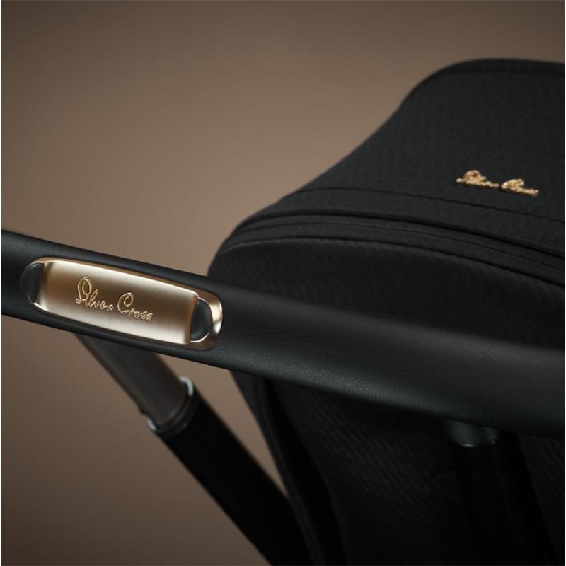 Silver Cross Reef 2 Multi-Terrain Stroller in Espresso Special Edition showcasing the handlebar with embossed logo detail.