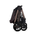 Silver Cross - Reef 2 Multi-terrain Modular Stroller in Ganache color, folded for easy storage, with visible wheels and sleek design.
