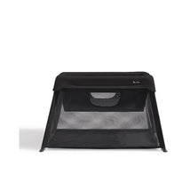 3-in-1 travel crib by Silver Cross, featuring a black mesh design for use as a crib, bassinet, and playard.
