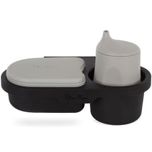 Universal snack tray by Silver Cross, featuring a black design with a gray container and cup, for easy feeding on-the-go.