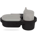 Universal snack tray by Silver Cross, featuring a black design with a gray container and cup, for easy feeding on-the-go.