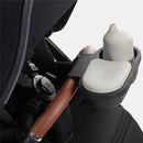 Universal Snack Tray for Silver Cross stroller, featuring a gray container and lid, with a cup holder attachment.