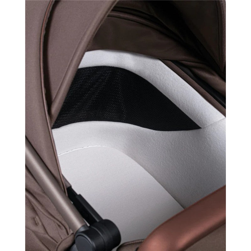 Close-up view of the interior fabric and mesh details of the Silver Cross Wave 3 stroller in Caramel color.