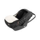 All Seasons Baby Car Seat Cover 4 in 1 by Skip Hop, featuring a black exterior, soft cream lining, and adjustable handle.