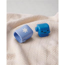Two blue baby bath toys on a textured blanket, including a smiling robot and a cup with a white snowflake design.