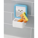 Skip Hop Baby Bath Toy Fresh & Clean Mirror Fun features a blue-framed mirror with a smiling face, surrounded by a white storage holder with colorful bath toy blocks.