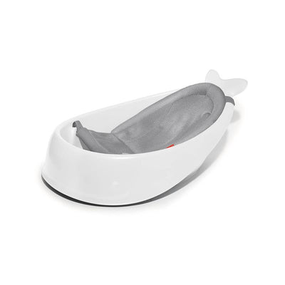3-stage Skip Hop Moby baby bath tub in white with a gray mesh sling for safety and comfort during bath time.
