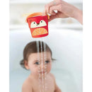 Colorful red and orange fox-shaped bath bucket pouring water onto a child in a bathtub.
