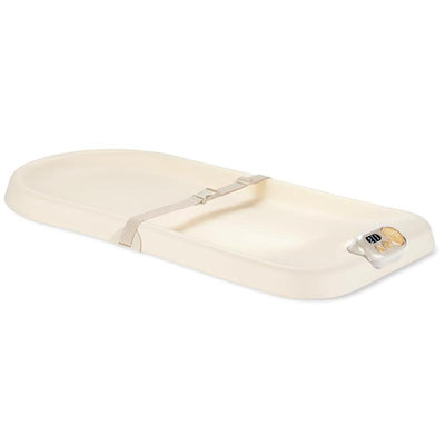 Baby changing pad in oat color with a safety strap and light-up feature for diaper changes.