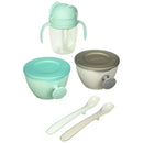 Teal and grey Skip Hop baby feeding mealtime set, including two bowls, a cup with handles, and two spoons.