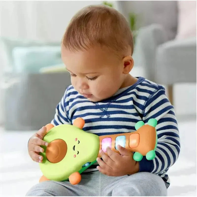 Baby playing with the Skip Hop Farmstand Rock-A-Mole Guitar, featuring colorful buttons and a smiling face.