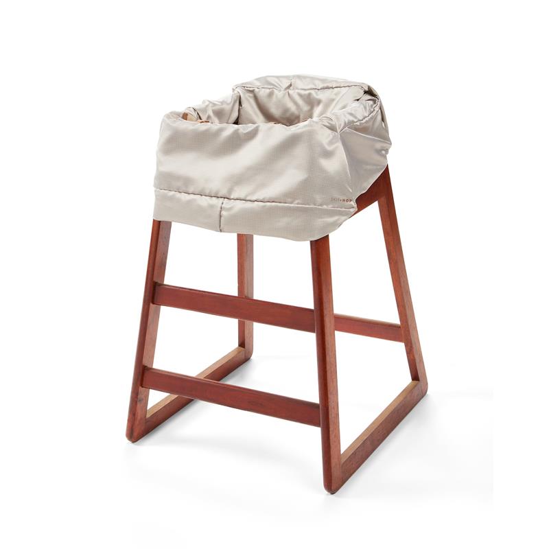 2-in-1 baby high chair cover and shopping cart cover in oat color, featuring a plush, secure design with a seatbelt.