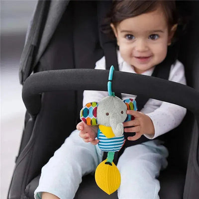 Skip Hop Bandana Buddies Elephant chime and teether toy, held by a smiling baby in a stroller, featuring colorful patterns.