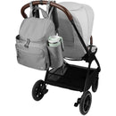 Skip Hop Diaper Bag Backpack in Forma Next Grey attached to a stroller, featuring multiple pockets and a side cup holder.