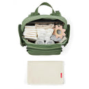 Skip Hop Diaper Bag Backpack in sage color, filled with diapers and baby items, with a portable changing pad below.