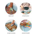 Toddler engaging with Skip Hop 3-in-1 Sensory Table, playing with colorful rice, sand, and building blocks.