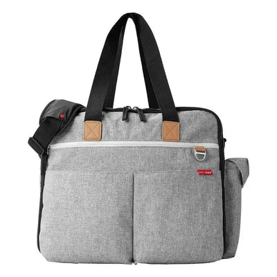 Grey Skip Hop Duo Weekender Diaper Bag featuring dual handles, a removable shoulder strap, and multiple external pockets.