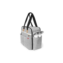Duo Weekender Diaper Bag by Skip Hop in grey with black accents, featuring multiple pockets and two side bottle holders.