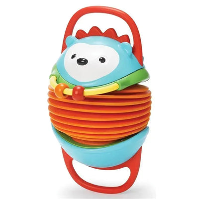 Colorful hedgehog toy with accordion-style sections, featuring a handle and playful facial design, promoting interactive play.