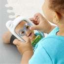 Baby plays with the Skip Hop Explore & More Selfie Cellphone Toy, smiling at their reflection in the mirror.