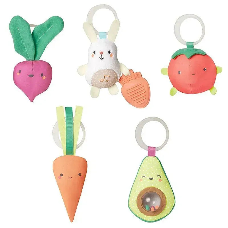 Colorful fabric toys shaped like fruits and vegetables, including a bunny and a rattling avocado, designed for babies.