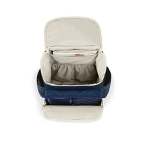 Skip Hop Forma Diaper Bag Backpack in navy, featuring an open top with beige interior and multiple compartments for organization.