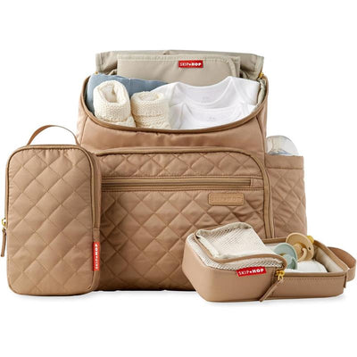 Skip Hop Forma Diaper Backpack in camel with organized compartments for clothing, accessories, and feeding items.