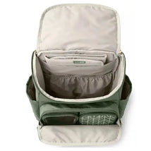Diaper backpack in sage color featuring multiple compartments, a gray interior, and a front mesh pocket for easy access.