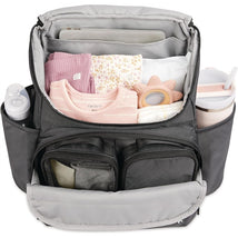 Skip Hop Forma Next Backpack in black, featuring organized compartments with baby clothes, a teether, bottles, and a large interior pocket.