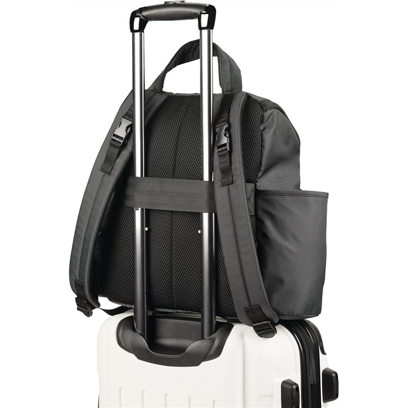 Black Skip Hop Forma Next Backpack secured on a wheeled suitcase, featuring adjustable straps and side pocket.