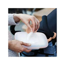 Hands reaching into a blush-colored Skip Hop Grab & Go Snug Seal Wipes Case, pulling out a moist wipe.