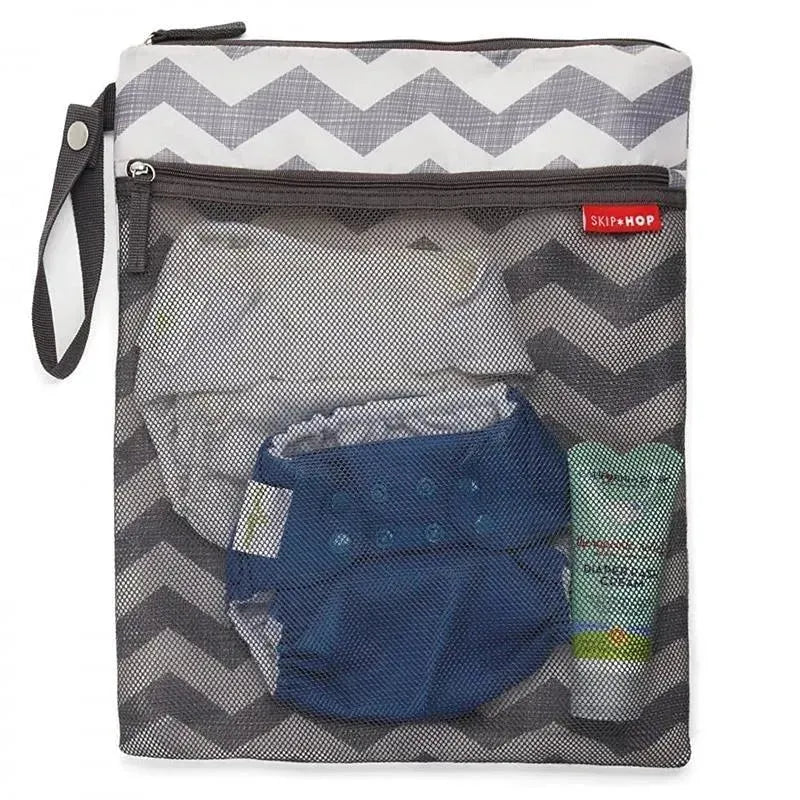 Wet/dry bag by Skip Hop features a chevron pattern with visible blue diaper, wipes, and cream inside the mesh pouch.