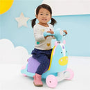 Child riding a colorful unicorn-themed ride-on toy, smiling and holding the handlebars, against a playful background.