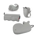 Grey Moby Baby Bath Essential Set from Skip Hop featuring a whale-shaped bath toy, pitcher, and a bath mat.