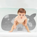Non-slip grey Moby bath mat with a child seated on it in a bathtub, surrounded by bubbles.