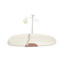 Skip Hop Nursery Style Wipe-Clean Changing Pad in oat color, featuring a mobile with a sun and cloud, and safety strap.