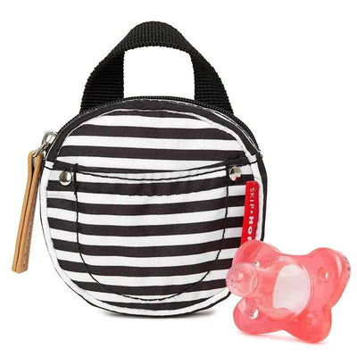 Black and white striped pacifier pocket by Skip Hop, featuring a small pink pacifier beside it.