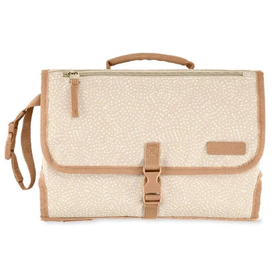 Portable baby changing pad in beige swirl dot pattern with a handle, zipper pocket, and buckle strap for secure closure.
