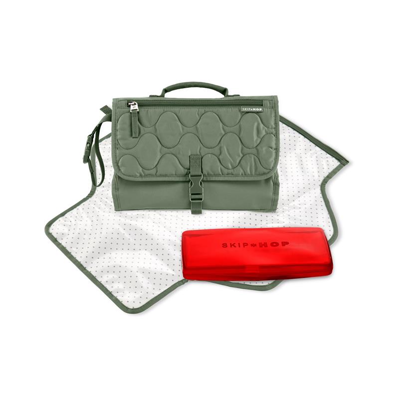 Portable baby changing pad in sage green with a zippered pocket, accompanied by a red wipe case.