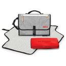 Portable baby changing pad in grey melange with a dotted surface and a red case, designed for easy diaper changes.