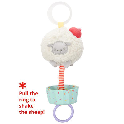 Sheep Cupcake Jitter Stroller Toy by Skip Hop, featuring a plush sheep with a colorful cupcake base and a pull ring to activate movement.