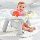 A baby sits in a Skip Hop Silver Lining Cloud 2-in-1 Activity Floor Seat with engaging toys, smiling happily.