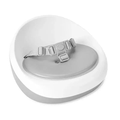Grey and white Skip Hop Sleek Seat Booster with a padded seat and adjustable safety strap.