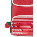 Strawberry-themed Skip Hop Big Kid Backpack with a clear front pocket displaying school supplies and a smiling strawberry zipper pull.
