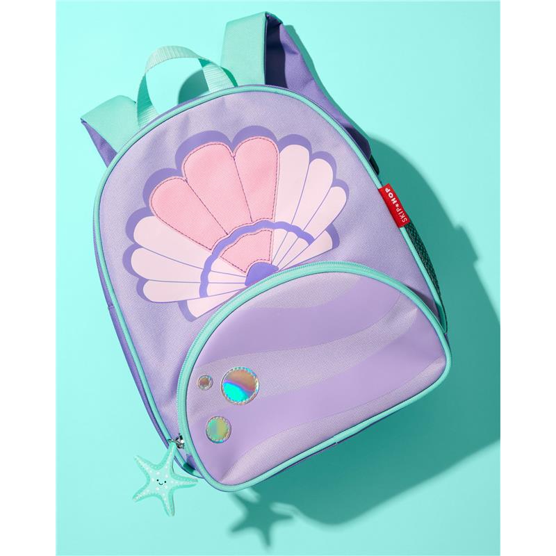 Skip Hop Spark Style Backpack in seashell design, featuring pink and purple colors, a star zipper pull, and adjustable straps.