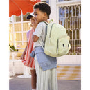Toddler boy with a green Dino backpack featuring adjustable padded straps, smiling alongside a girl in a striped outfit.